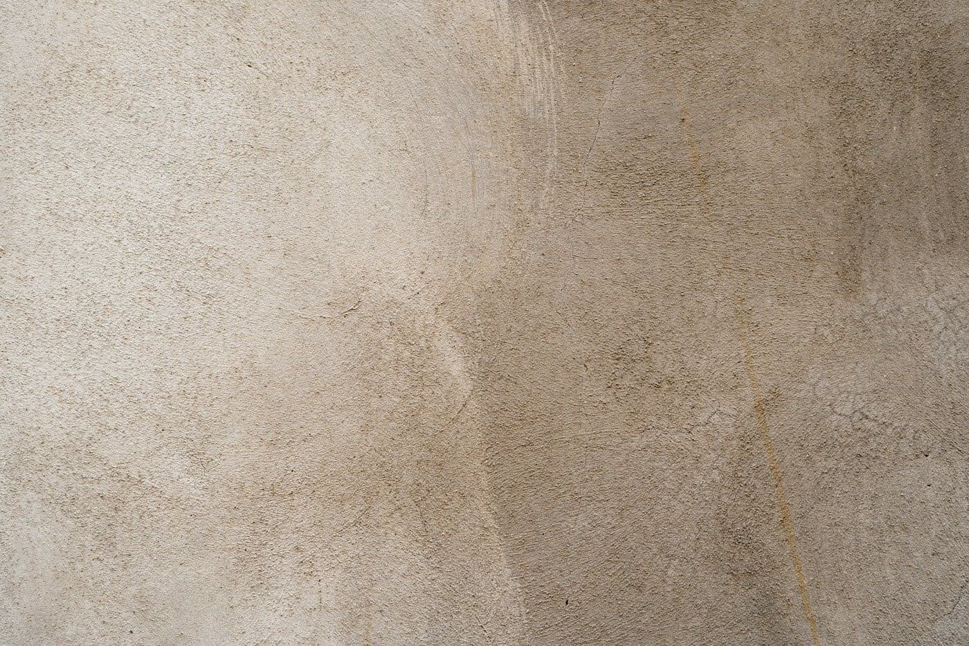 Soft beige and tan mineral wall texture with subtle tonal variation