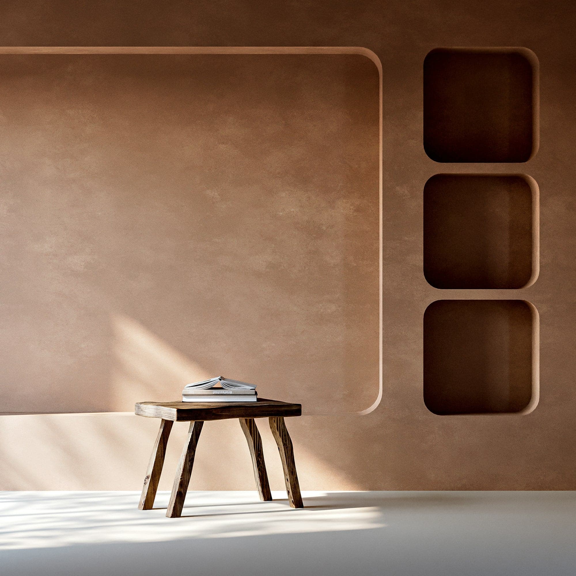 A burnished clay-toned plaster feature wall with sculpted rounded niches